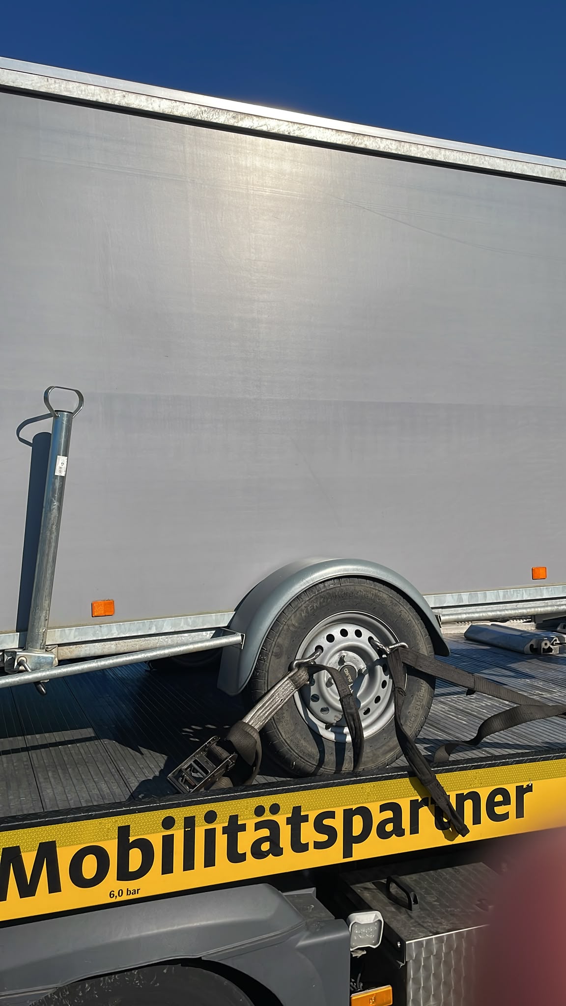 truck roadside assistance on site — Truck Tyre Service in a Distribution Centre Car Park: Trailer Wheel Change in Gütersloh
