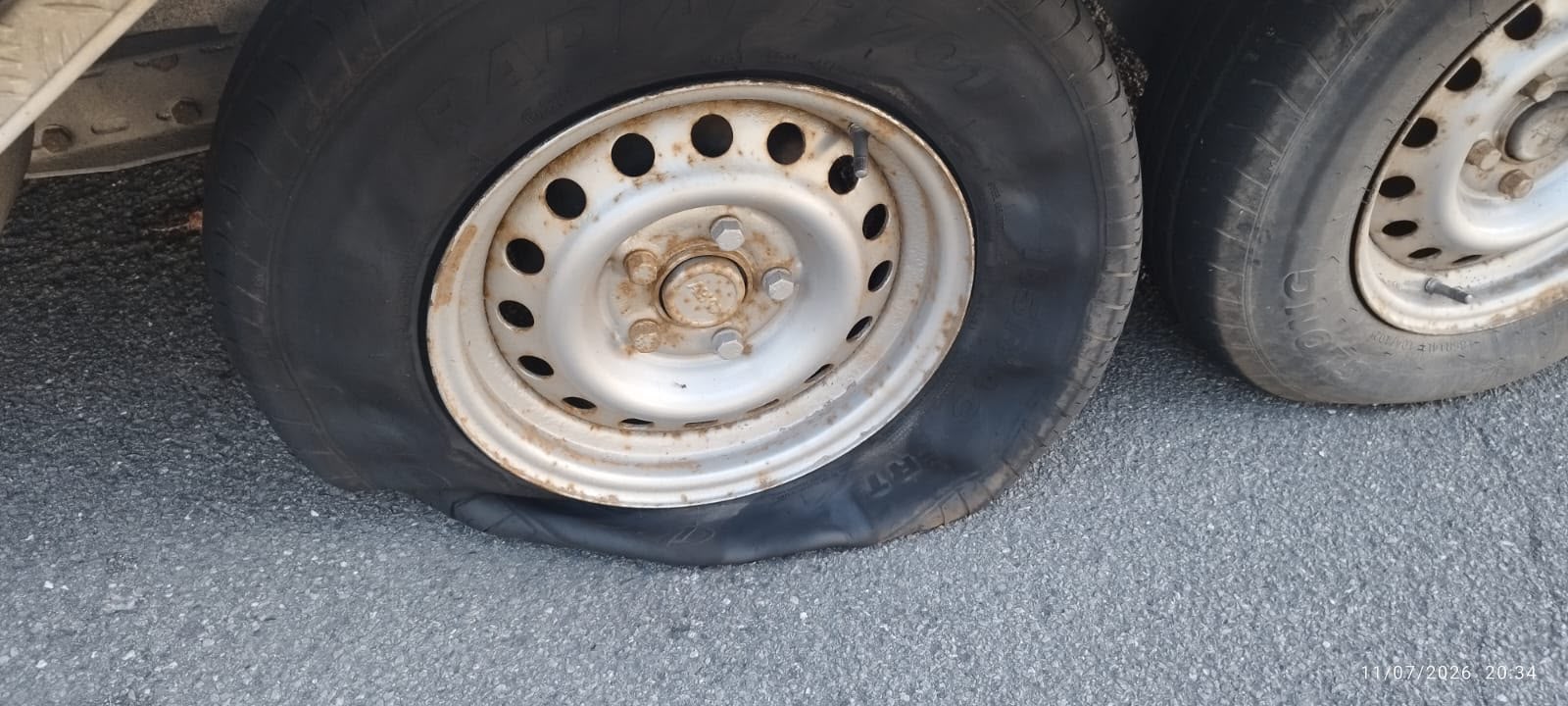 truck roadside assistance on site — Truck Tyre Service in a Distribution Centre Car Park: Trailer Wheel Change in Gütersloh